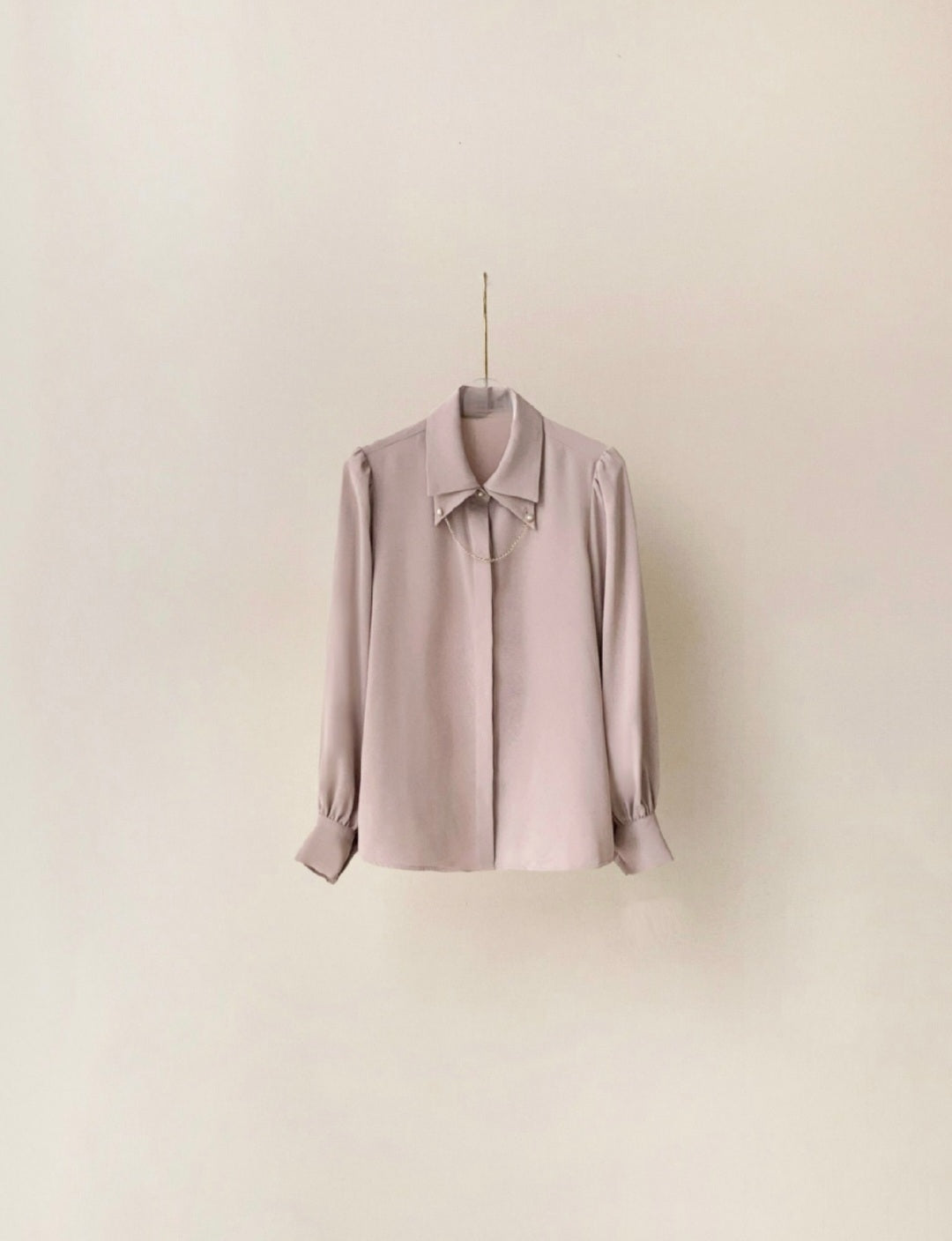 Shirt with cuff link chain