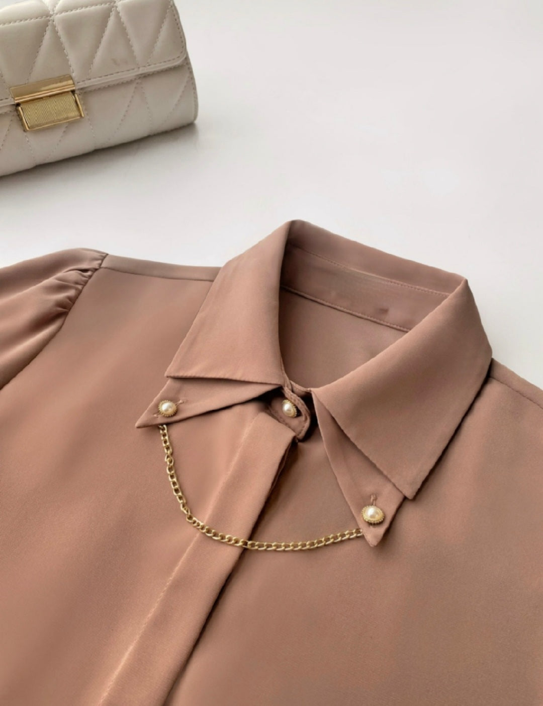 Shirt with cuff link chain