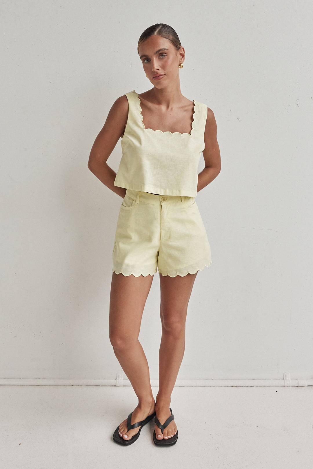 Butter yellow linen shorts for women with scalloped hem and high waist
